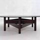 Wooden coffee table with round smoked glass top