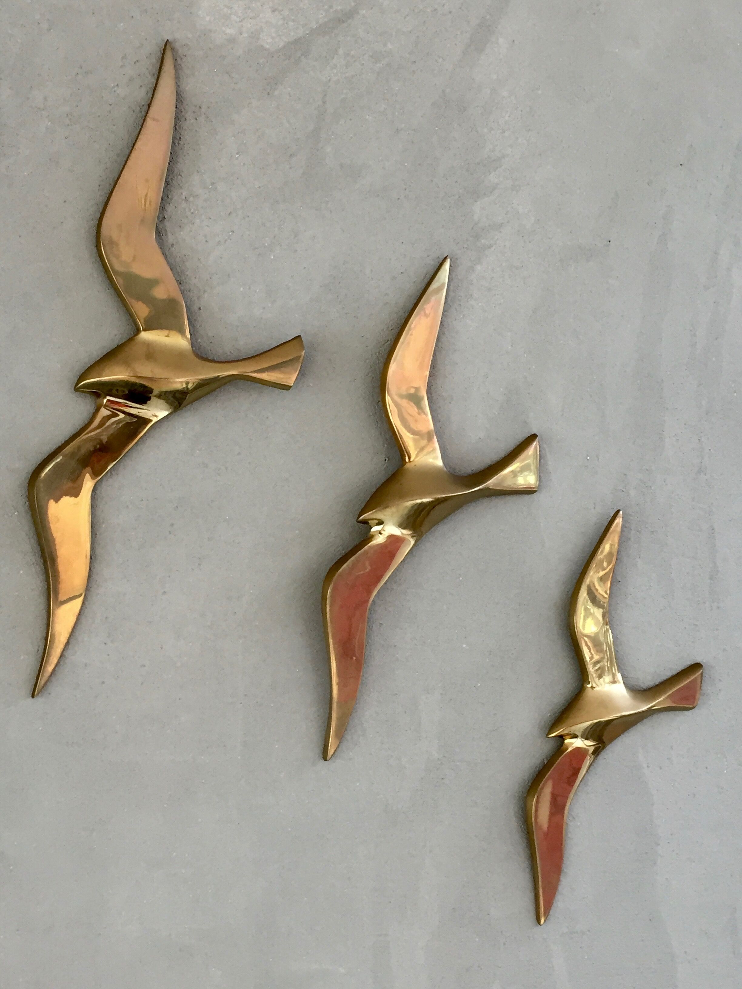 Trio of brass birds
