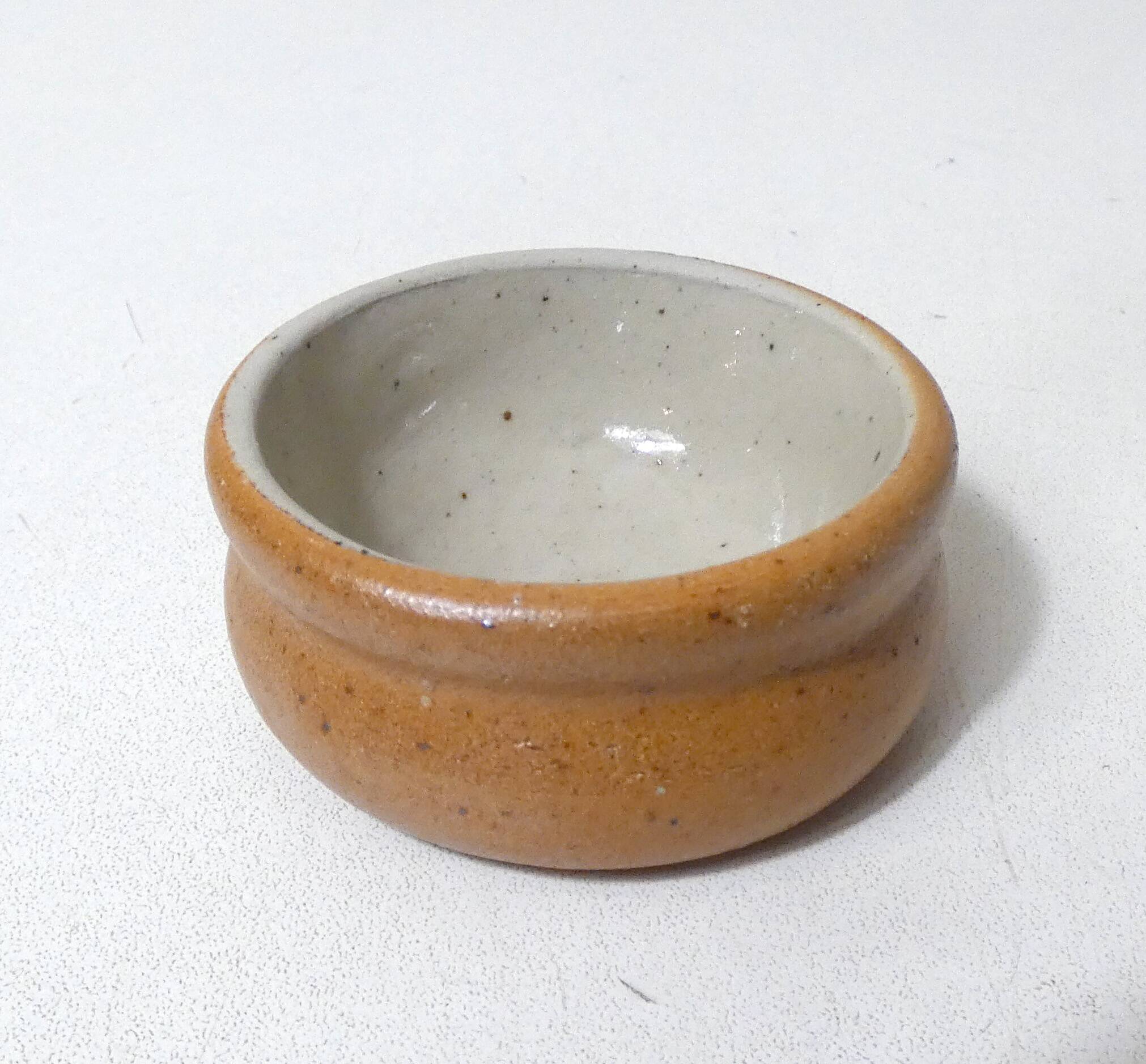 Old small individual butter dish in vintage stoneware