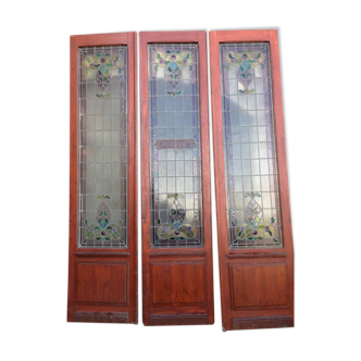 Late 19th century store doors, haberdashery front with Art Nouveau stained glass windows