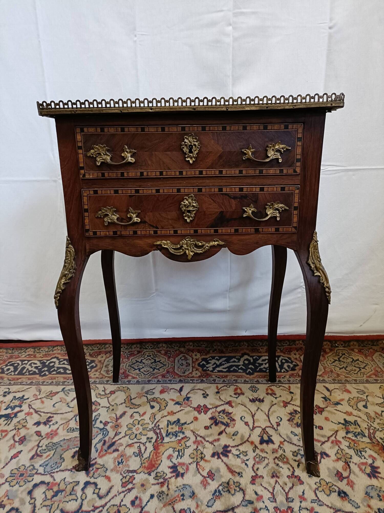 Small Louis XV chest of drawers in inlaid wood
