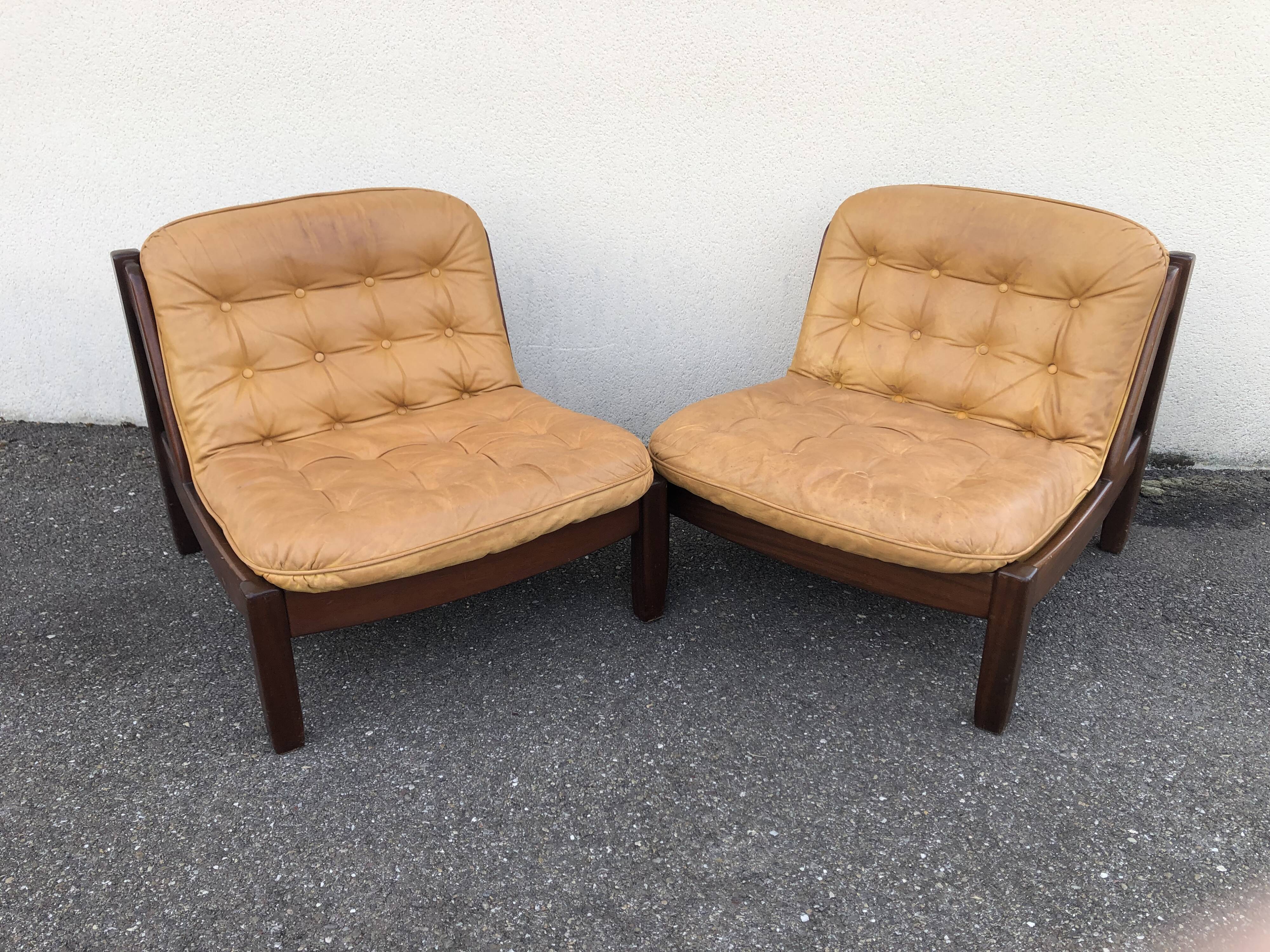 Leather and wood armchairs 70s