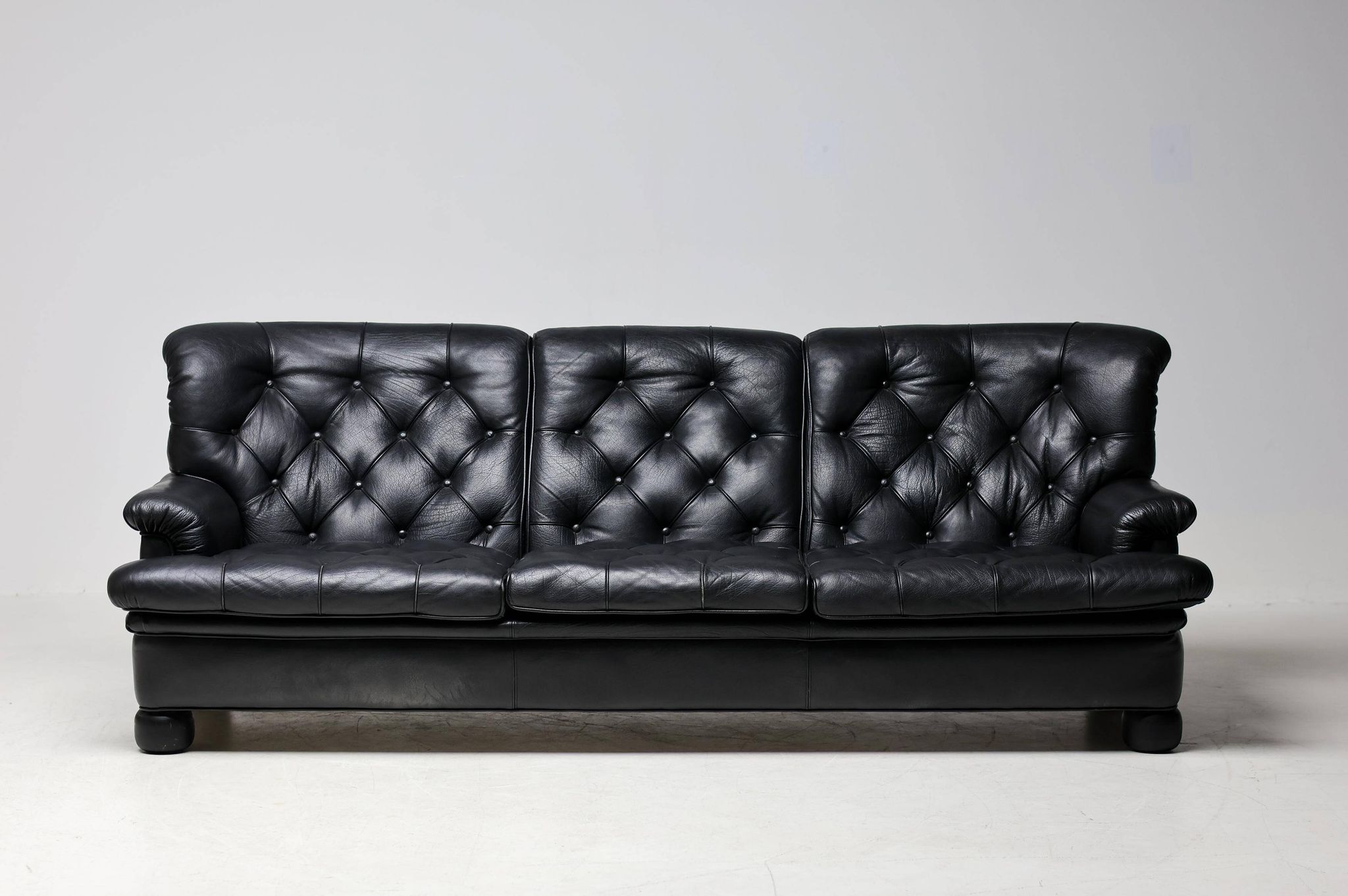 Three-seater sofa "Jupiter" in black leather by Arne Norell, Sweden, 1960.