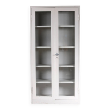 1960s Industrial bookcase gray metal with glass in the doors