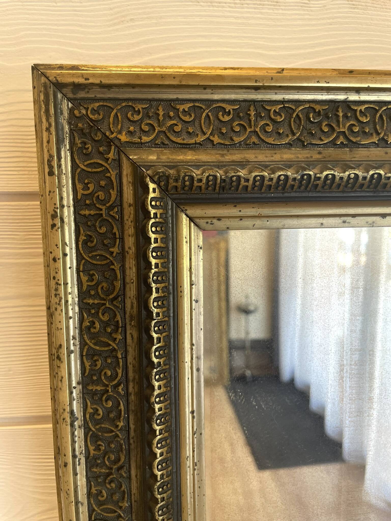 Large gilded antique mirror with moulding in the Napoléon III style.