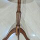 English style gueridon in wood – top covered with green/gold leather