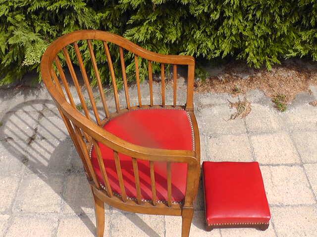 Red leather armchair and footrest