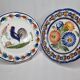 Pair of Henriot Quimper flat plates decorated with rooster and flowers