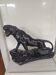 Large animal sculpture representing a roaring panther, signed BE.