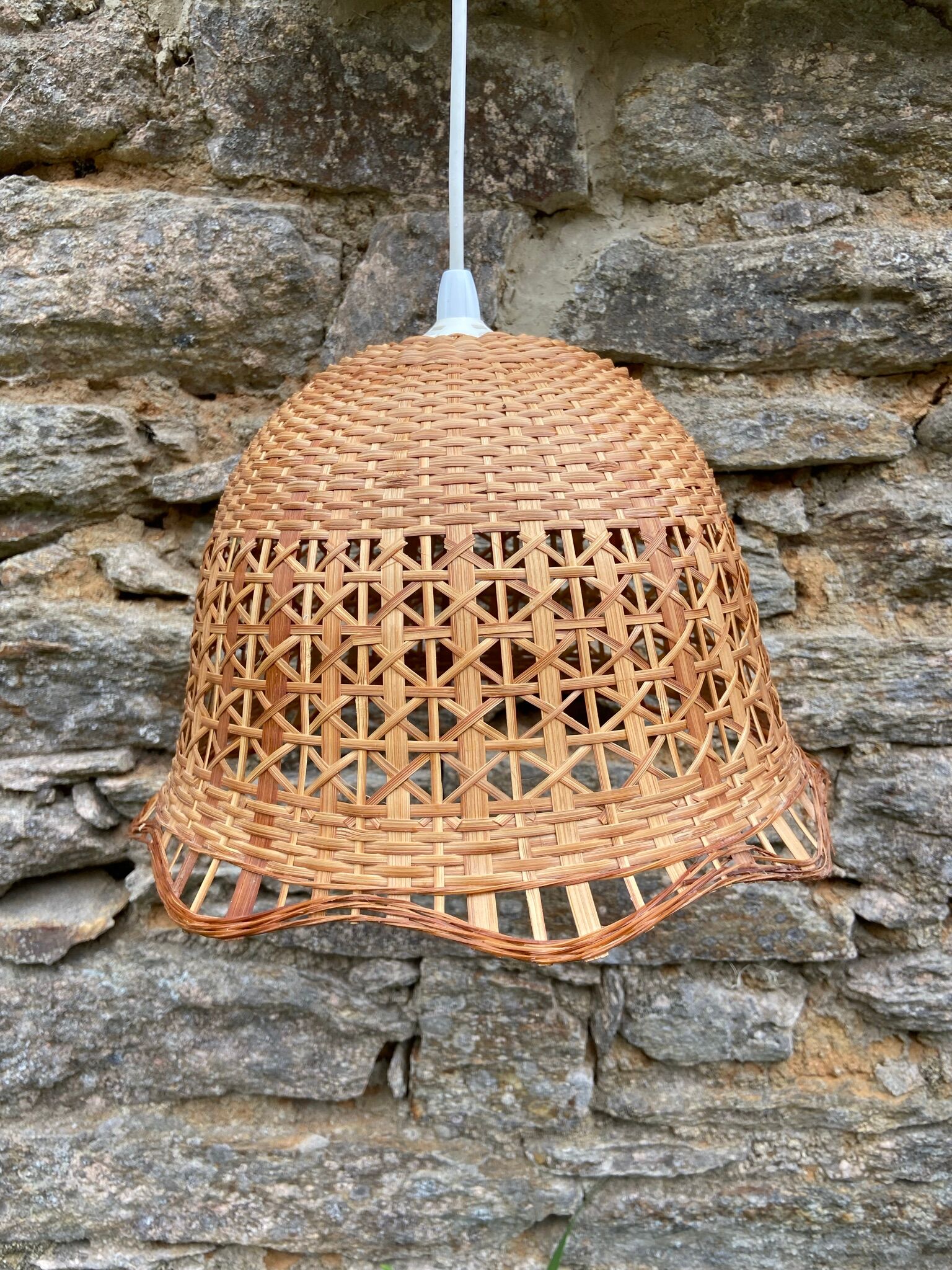 Suspension in rattan and vintage wicker bell shape