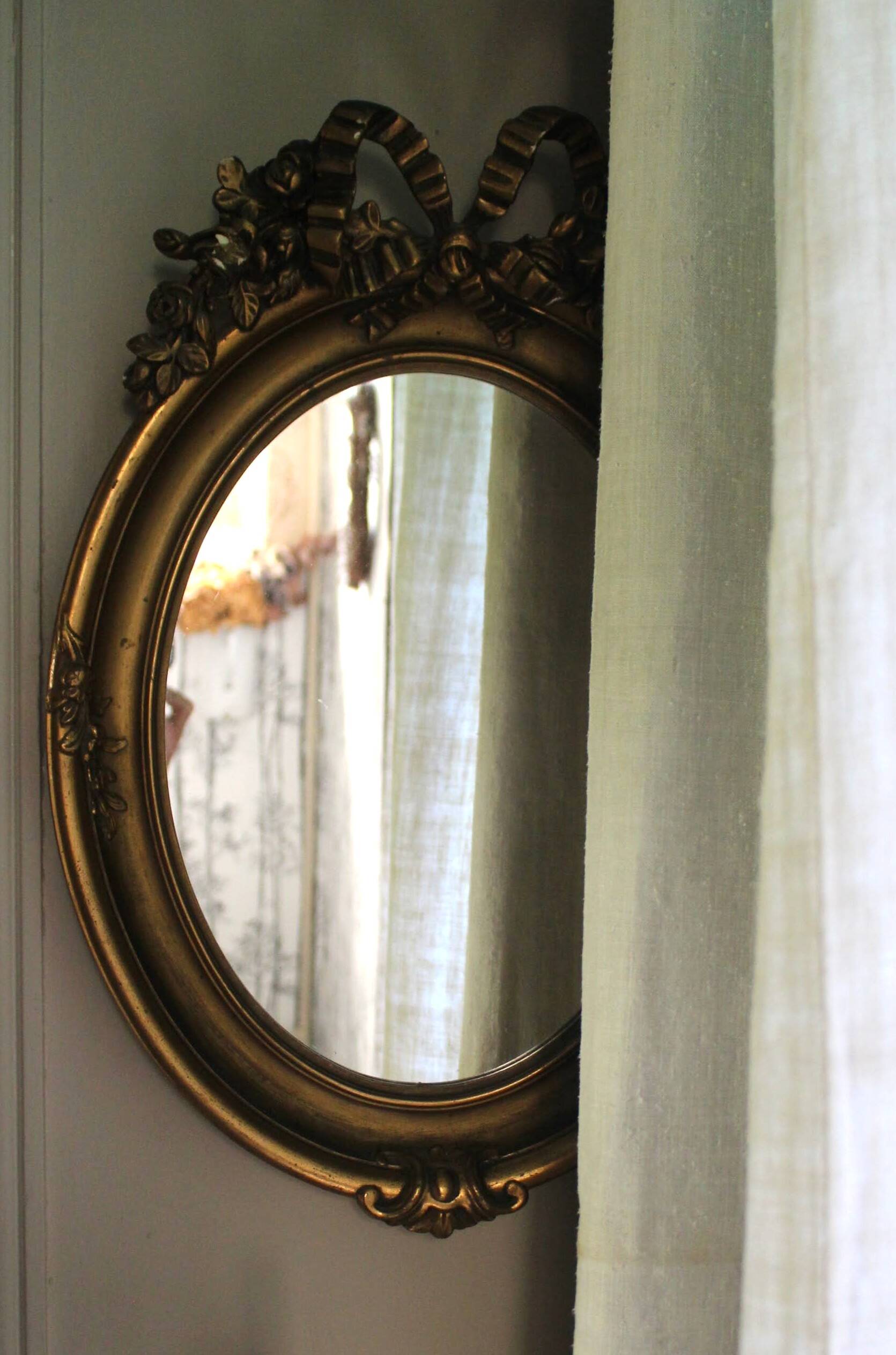 Golden Oval Mirror with Bow and Roses Decor