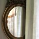 Golden Oval Mirror with Bow and Roses Decor