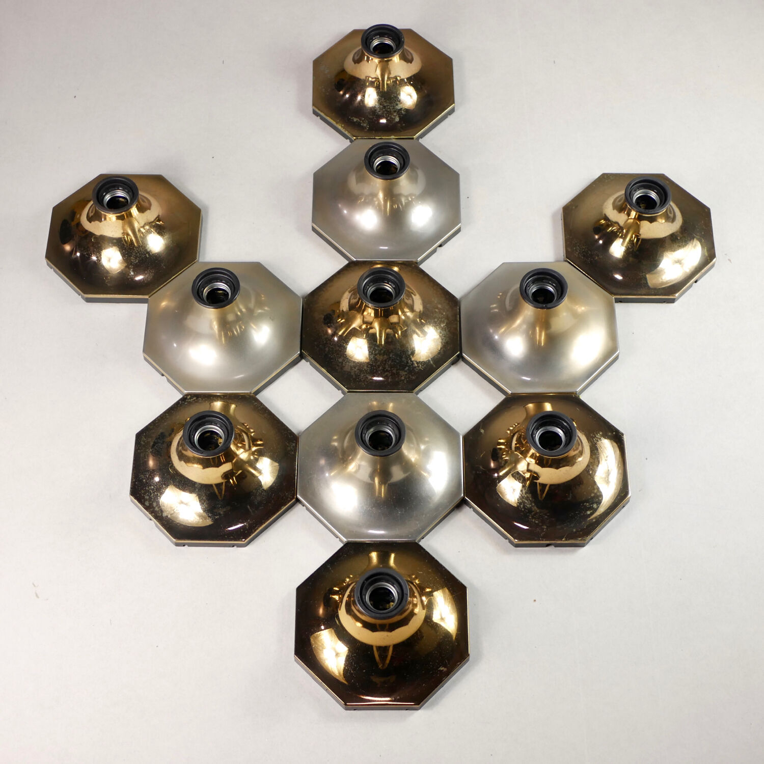 Suite of 11 octagonal brass wall lamps by Motoko Ishii