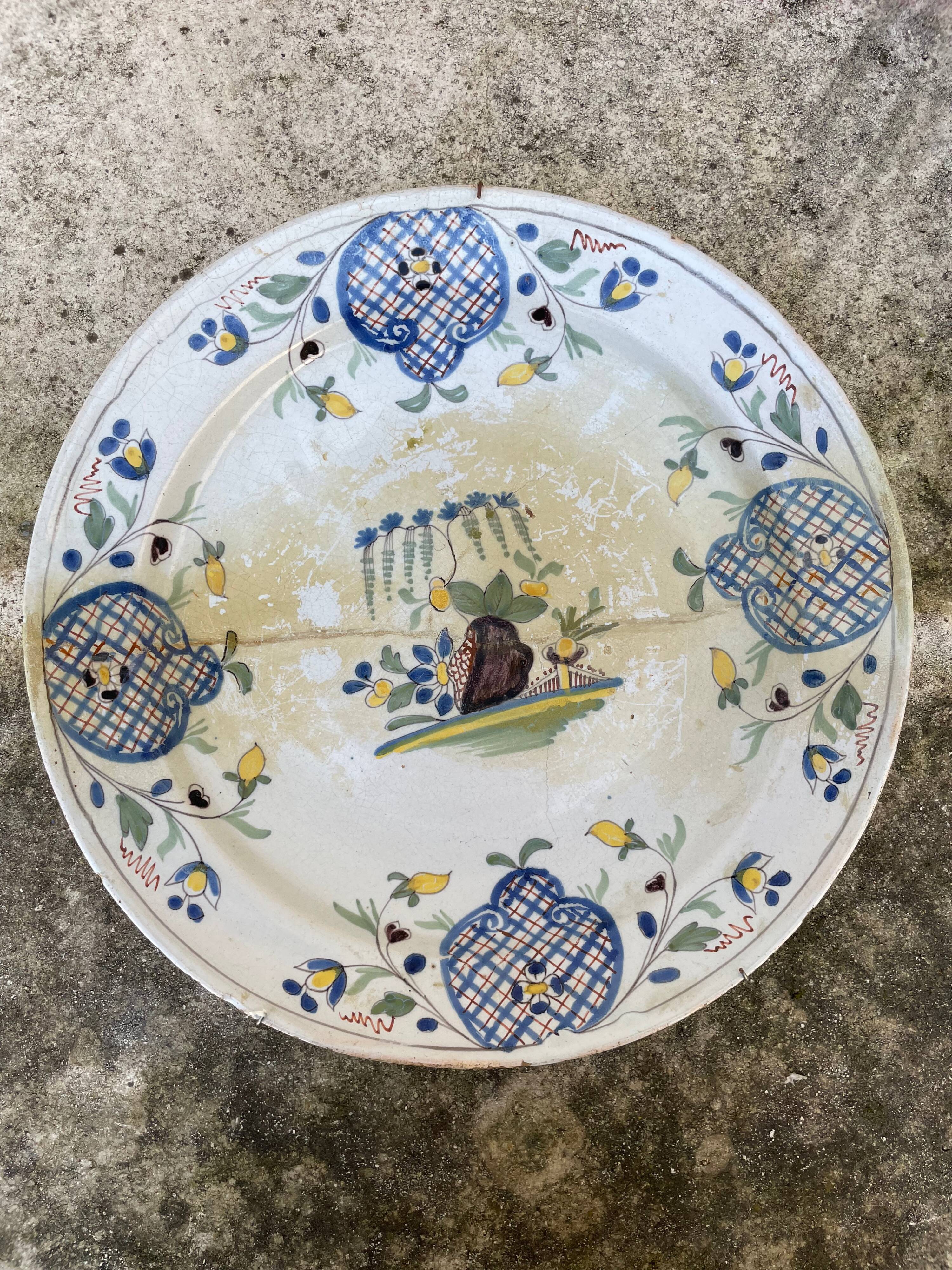 Restored antique dish with floral motif