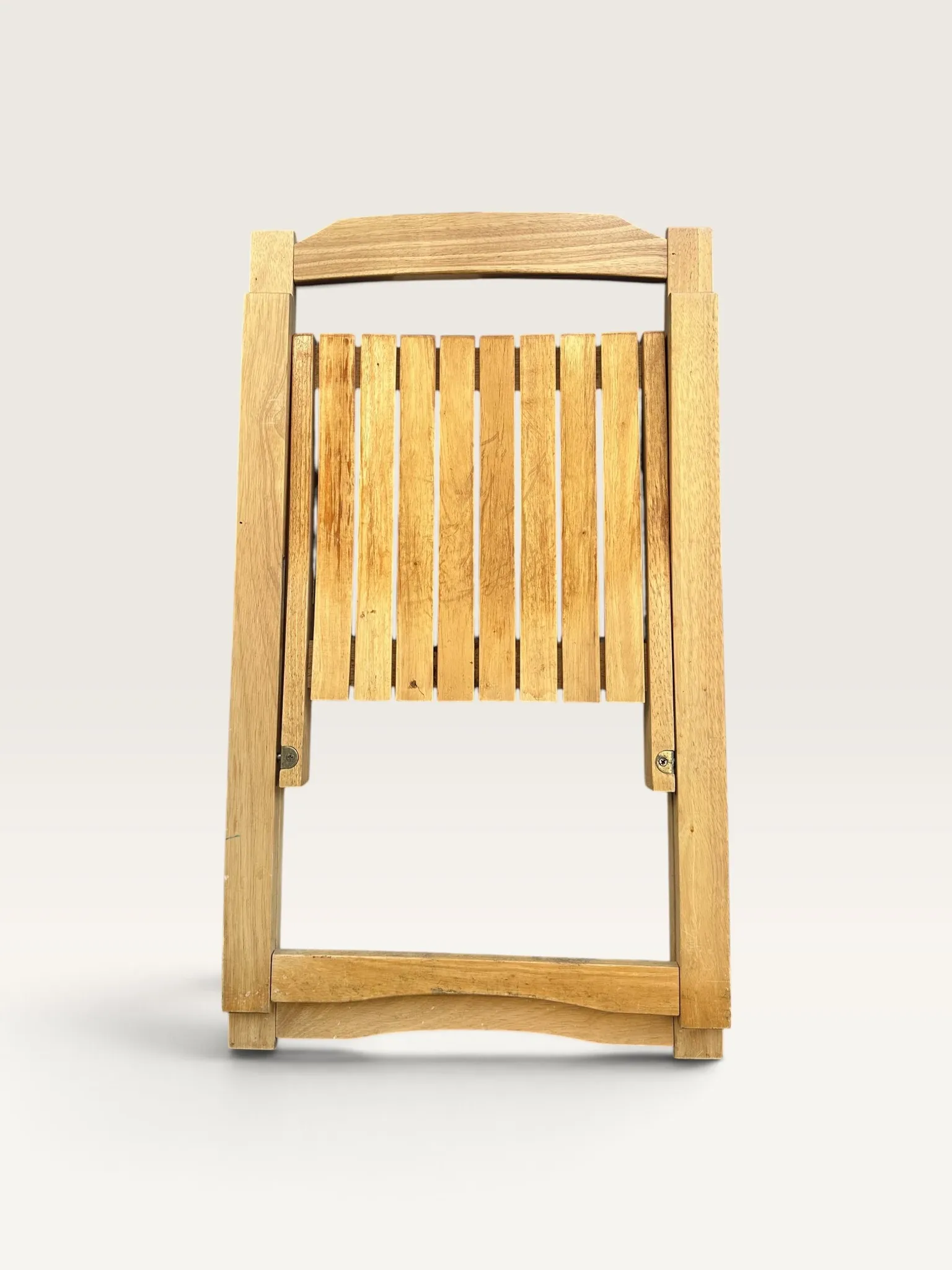 Blonde wooden folding chair in the style of Aldo Jacober.