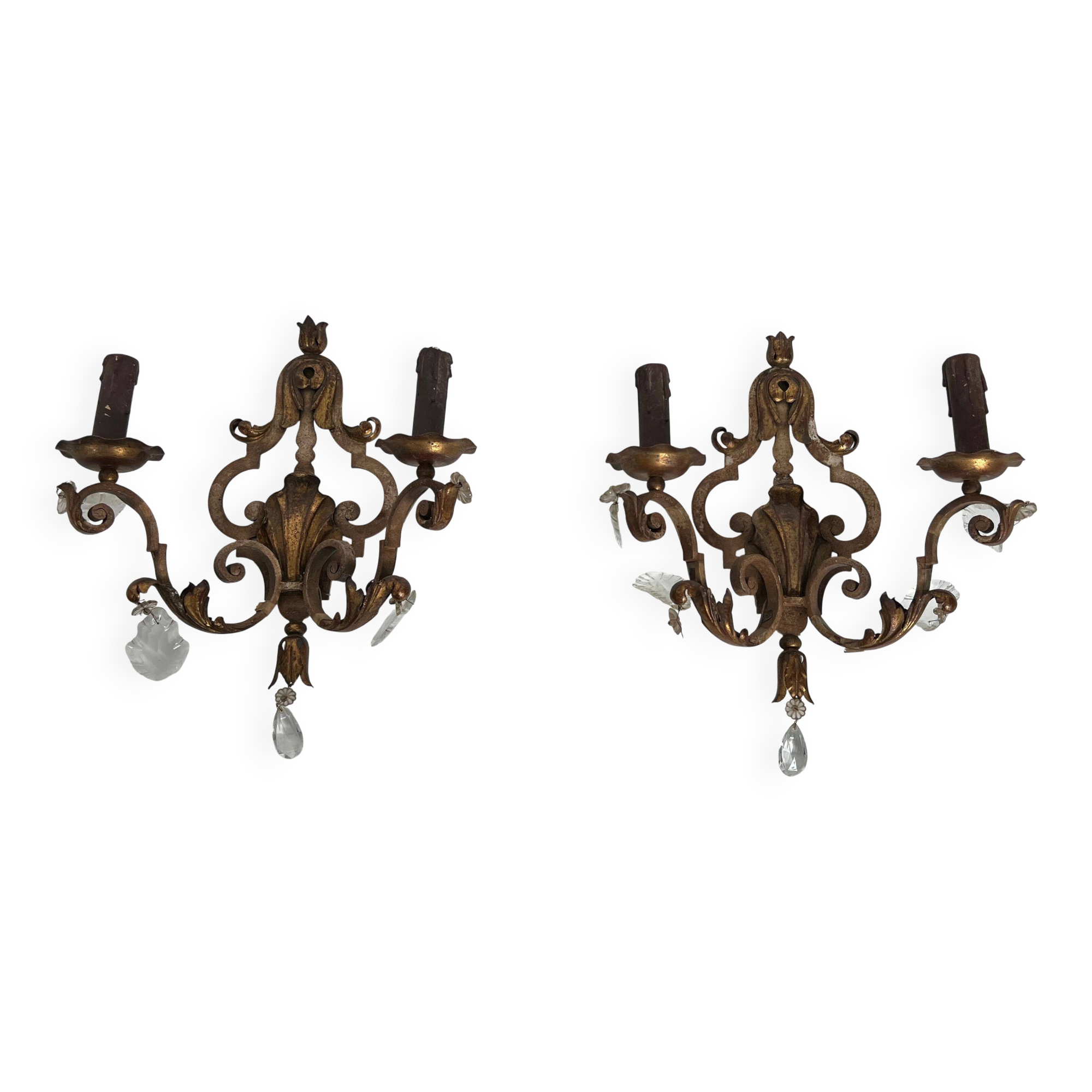 Pair of patinated wrought iron wall sconces with golden acanthus leaves and crystals.