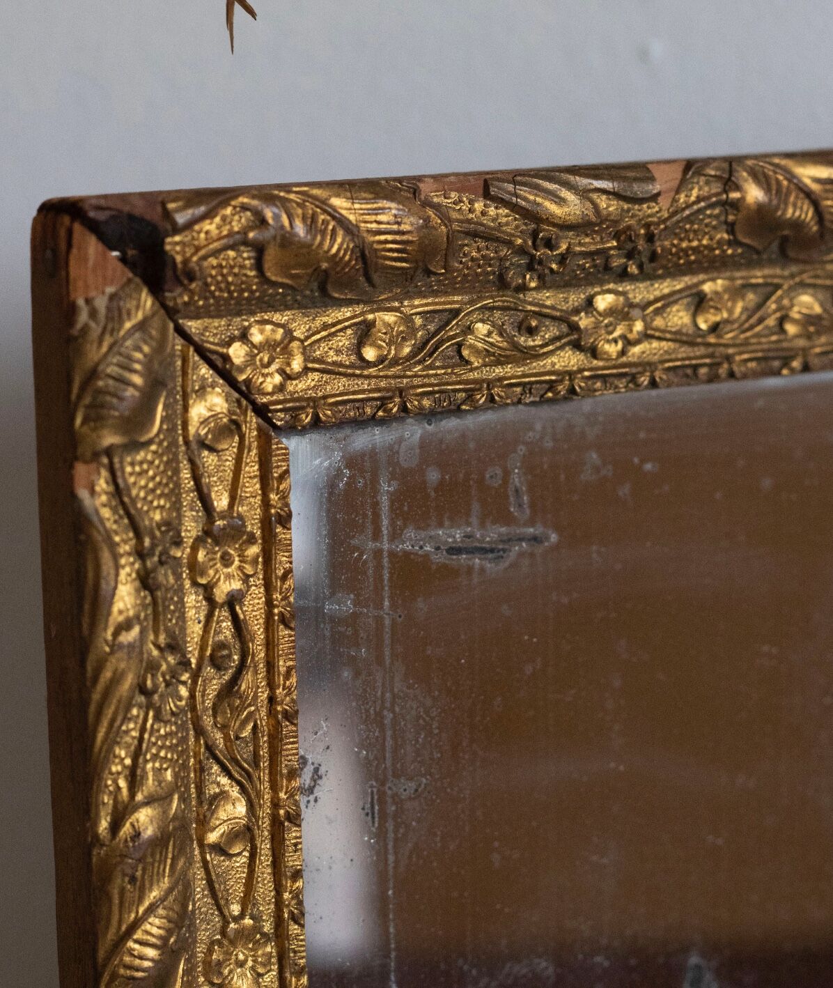 Antique mirror in gilded wood