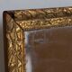 Antique mirror in gilded wood