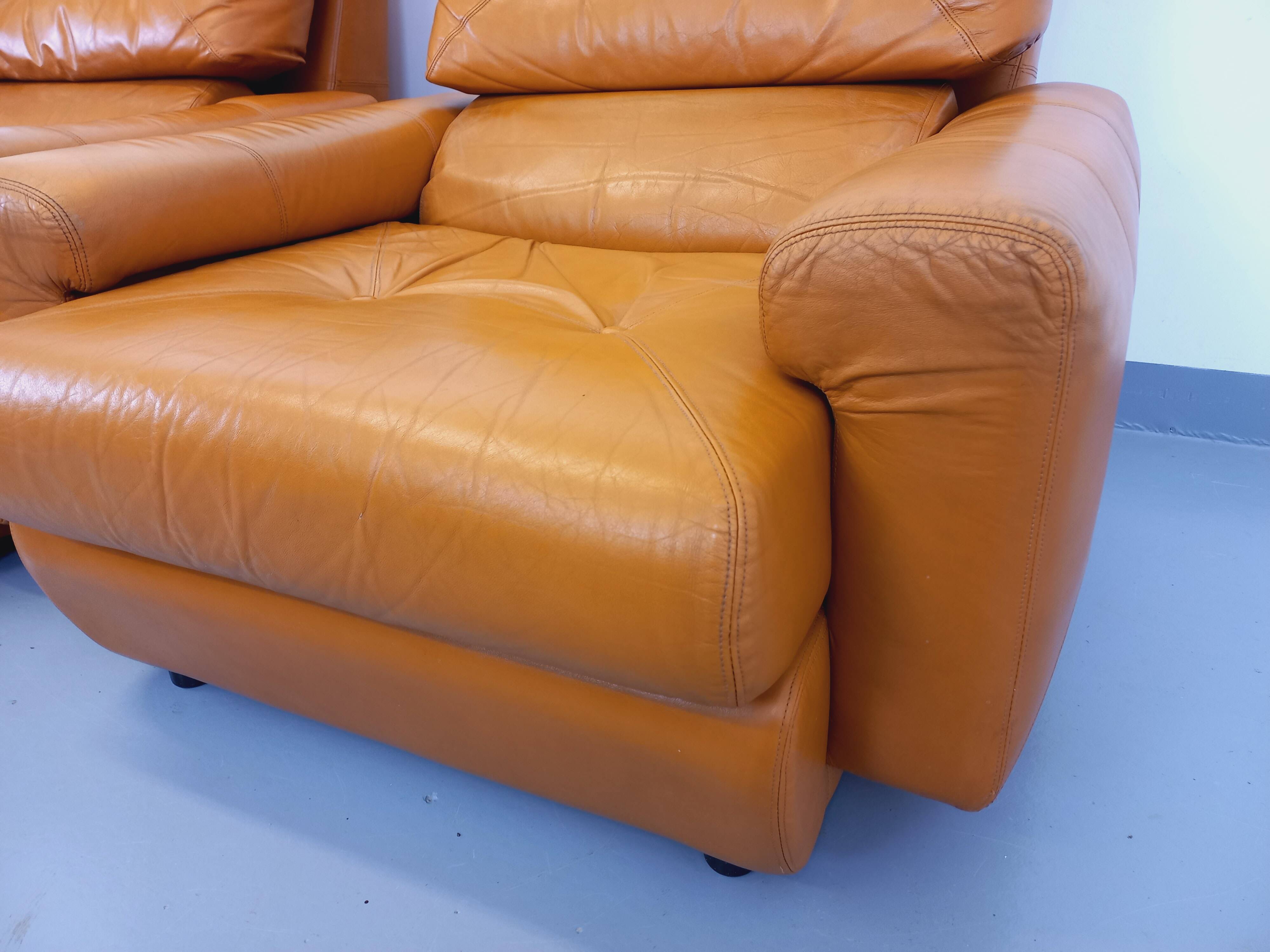 Pair of vintage leather lounge chairs from the 60s and 70s