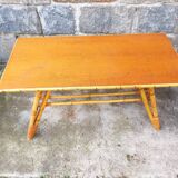 Rattan coffee table with compass legs
