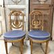 Paire de chaises style Louis XVI en bois doré