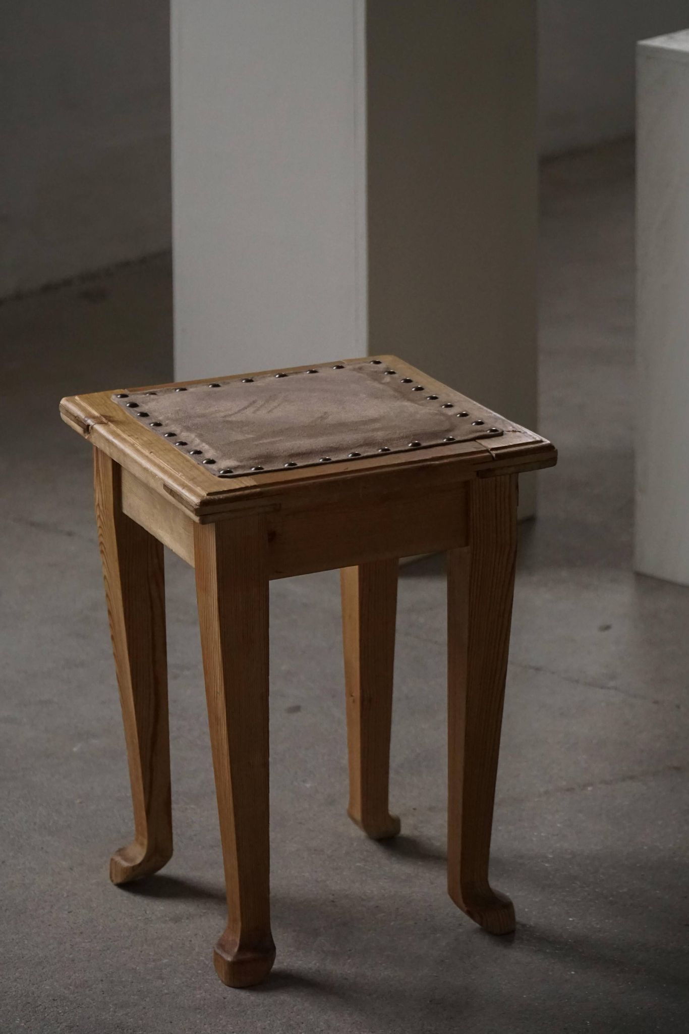 A pair of antique Danish pine stools from the late 19th century.