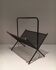 Black lacquered metal design magazine rack, perforated sheet and brass