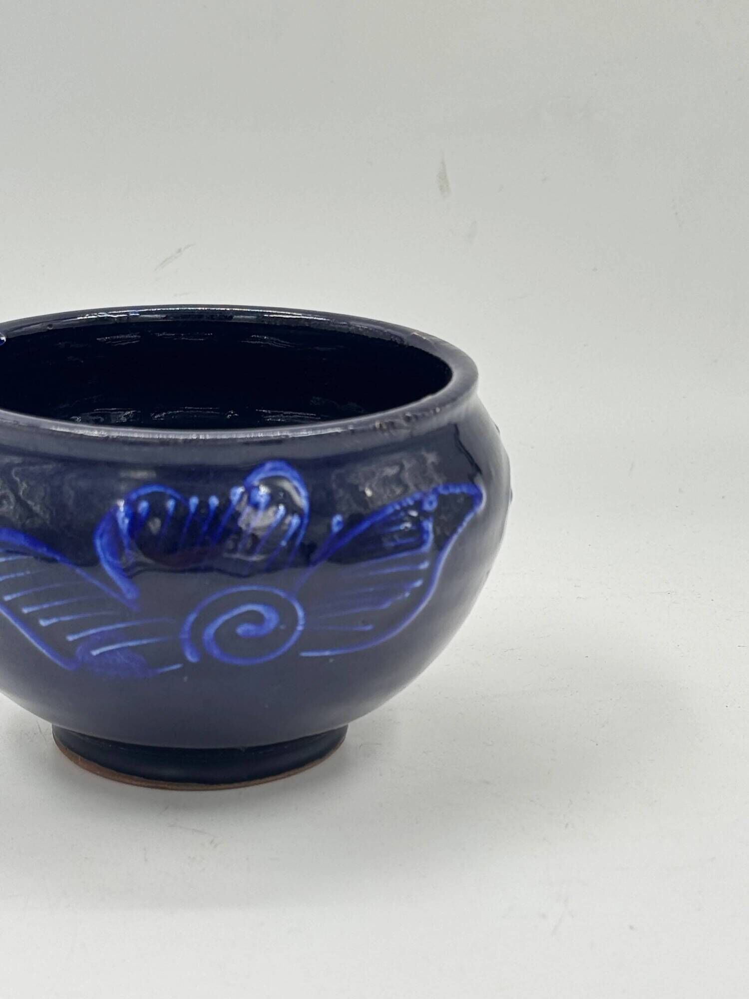 Vintage decorative bowl in cobalt blue ceramic.