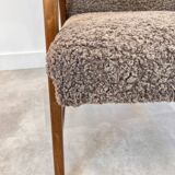 Danish teak & curly armchair