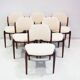 Set of six hardwood chairs by Arne Vodder for Sibast with white textile upholstery.