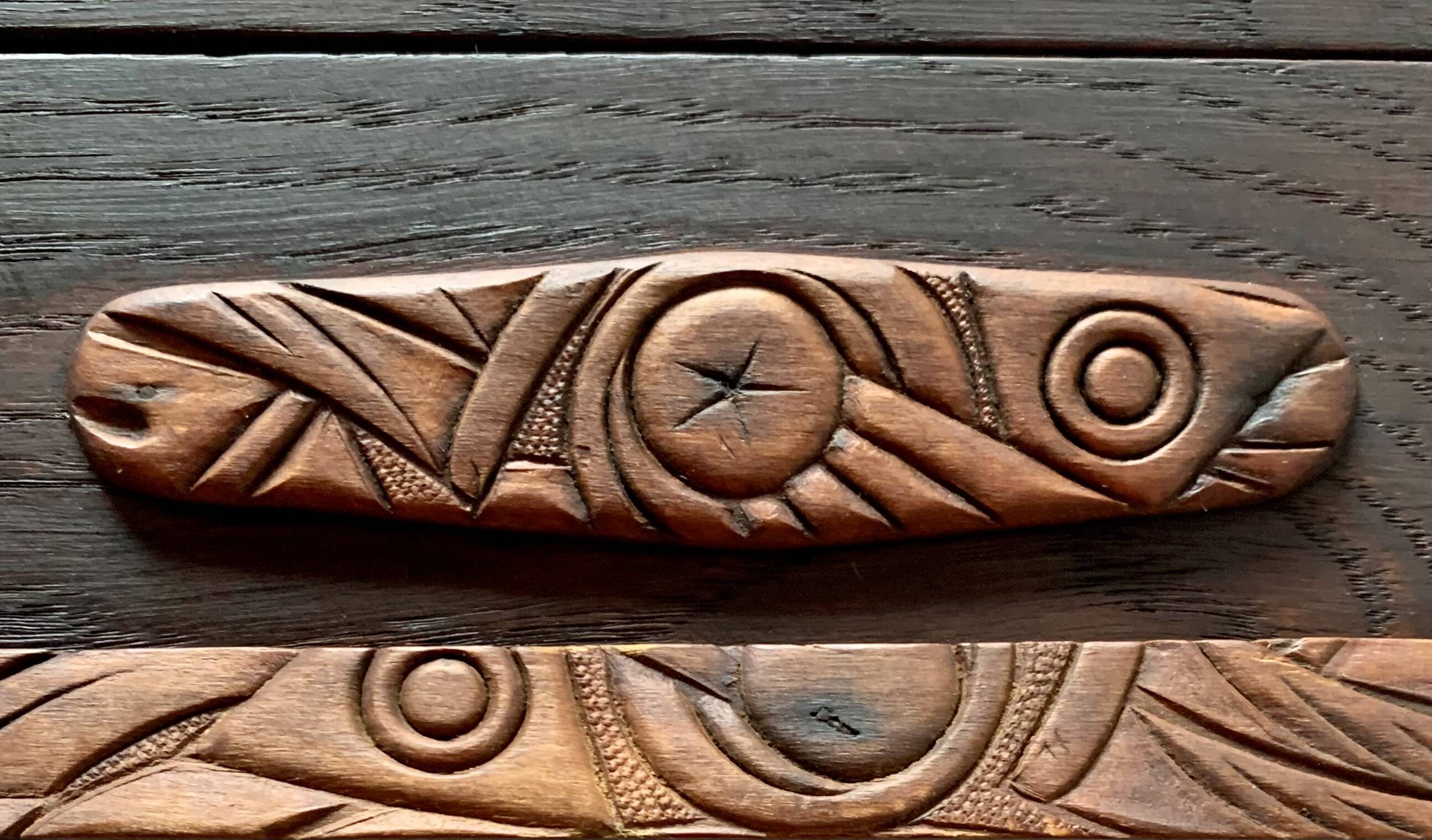 Old carved wooden medicine cabinet with beveled mirror