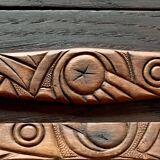 Old carved wooden medicine cabinet with beveled mirror