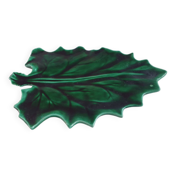 empty green ceramic pocket cup, small chips on the edges, signed