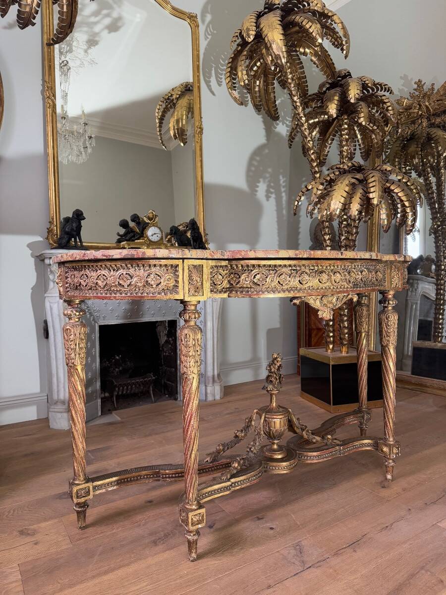 Console with 4 legs from the end of the 19th century in gilded wood in the Louis XVI style.