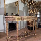 Console with 4 legs from the end of the 19th century in gilded wood in the Louis XVI style.
