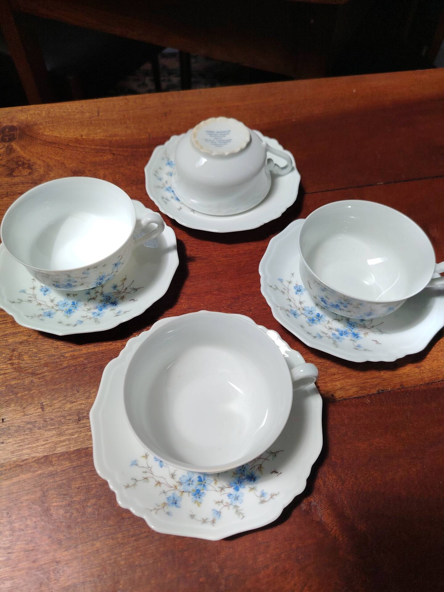 Set of 4 Limoges porcelain cups and saucers.