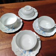 Set of 4 Limoges porcelain cups and saucers.