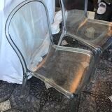 2 transparent plexiglass chairs