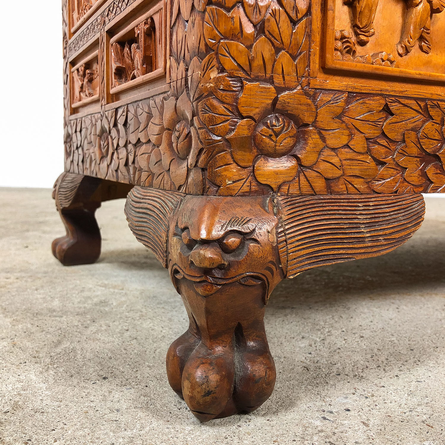 Vintage Chinese carved camphor wood chest on claw feet