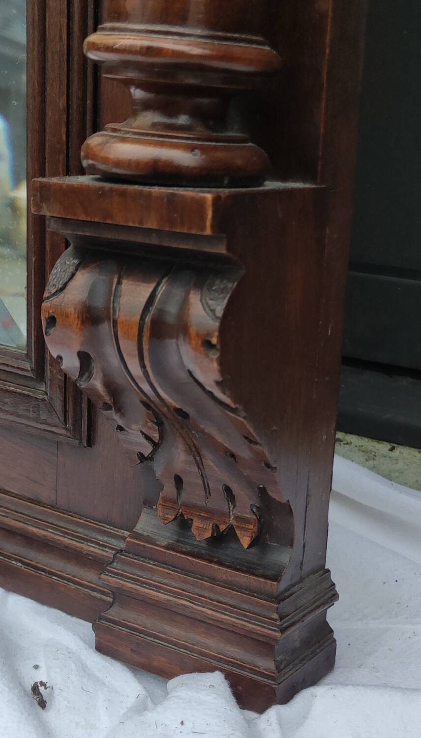Old large carved wooden mirror