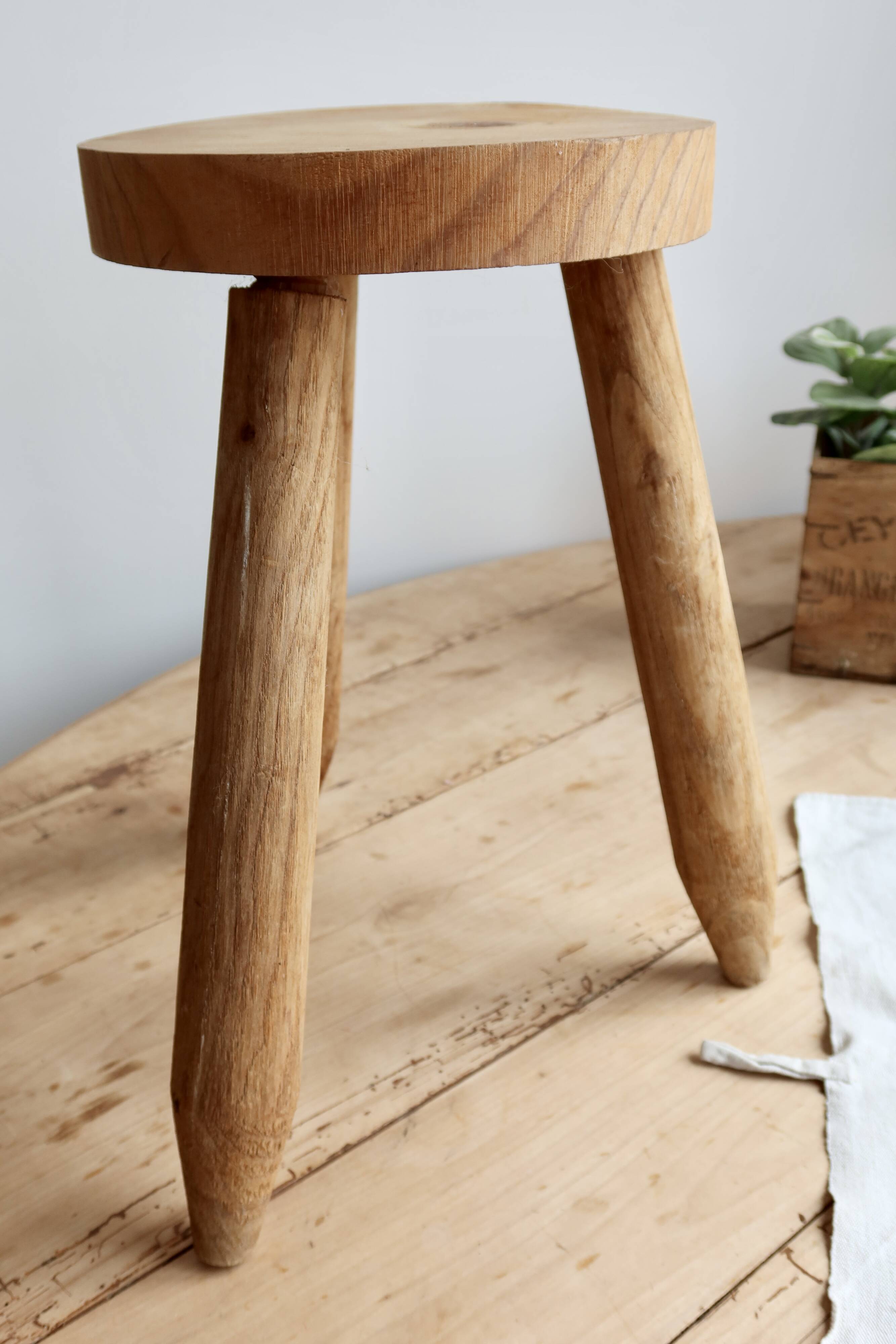 Vintage tripod stool in light raw wood