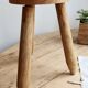 Vintage tripod stool in light raw wood