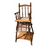 Old baby high chair in wood and canework