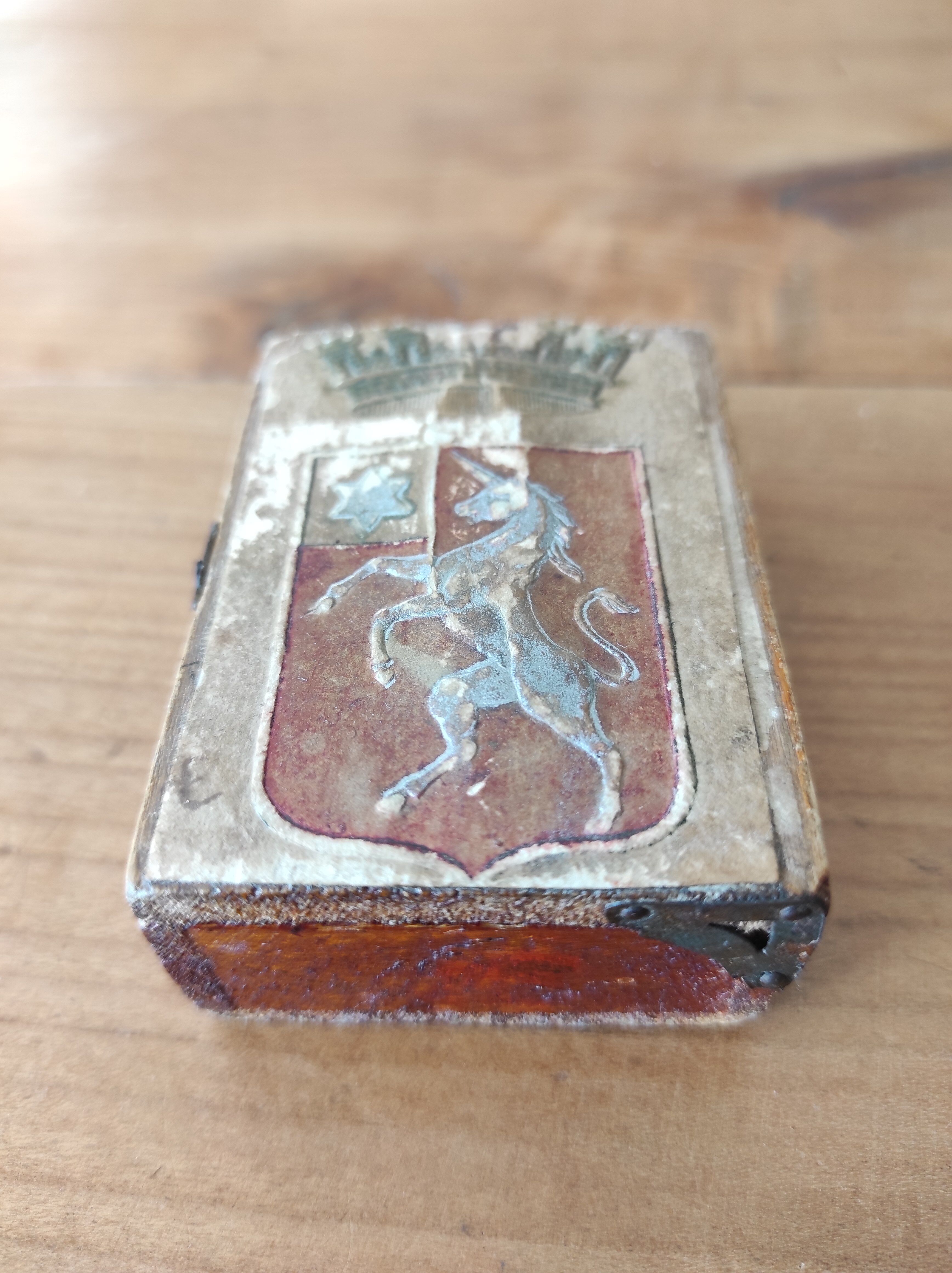 Wooden box decorated badge and unicorn