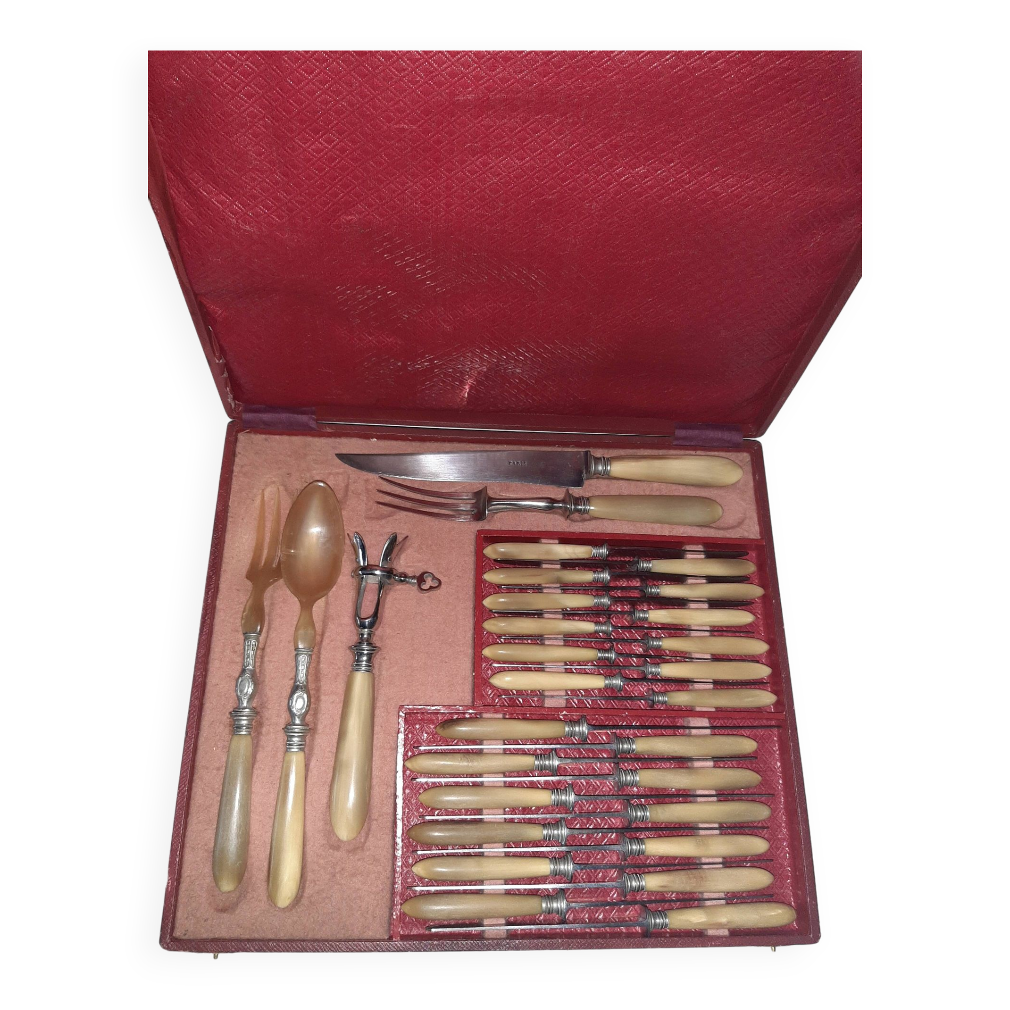 29-piece horn cutlery set, knives and serving utensils.