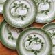 7 earthenware dessert plates with apple decoration and slip-brushed rim, KG Lunéville