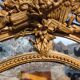 Large closed mirror, 19th century, wood and gilded stucco.