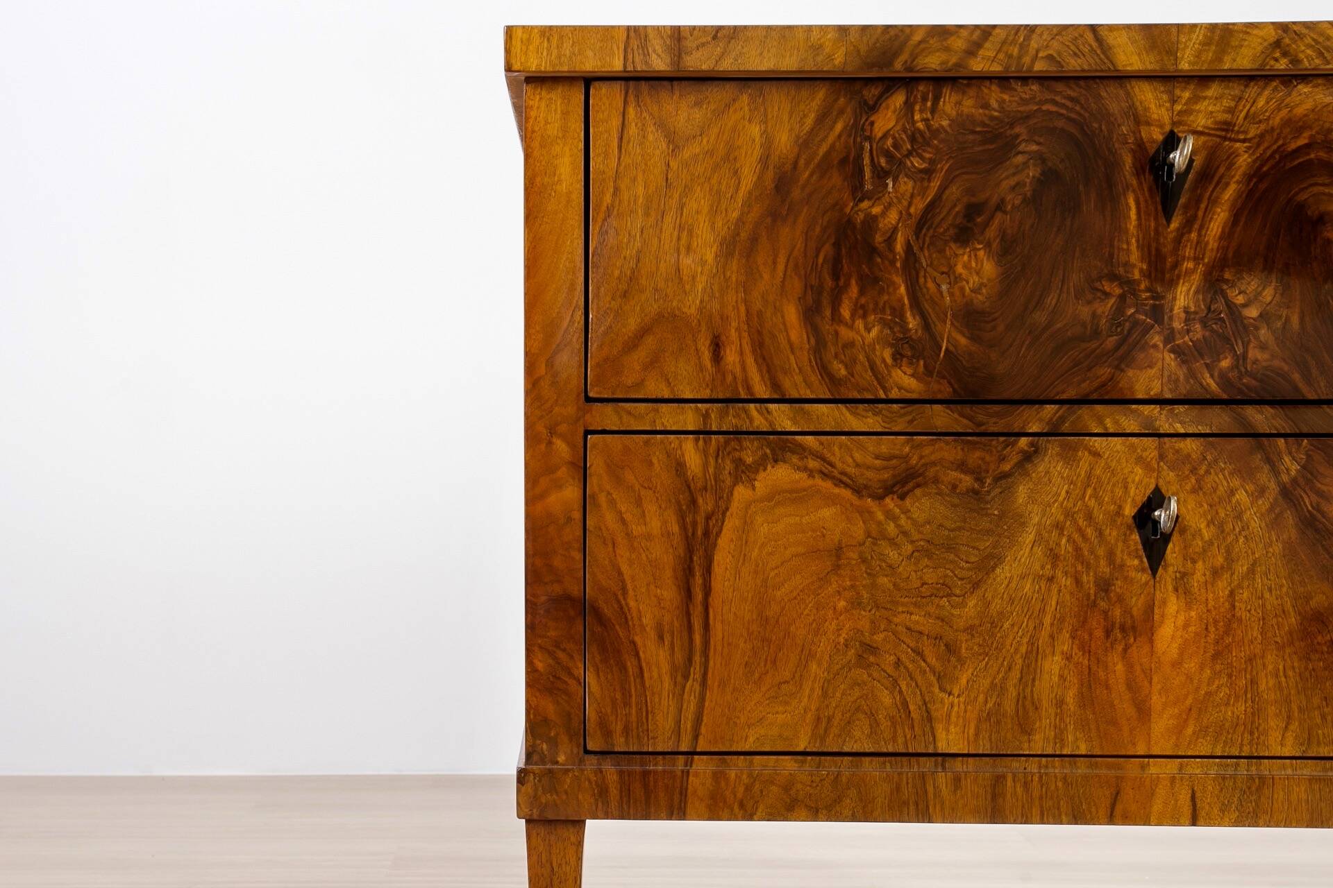 Elegant pair of Biedermeier style walnut commodes, Germany, French polish.