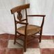 Light wood armchair seated in vintage straw dimension: height -78cm- width -54cm-