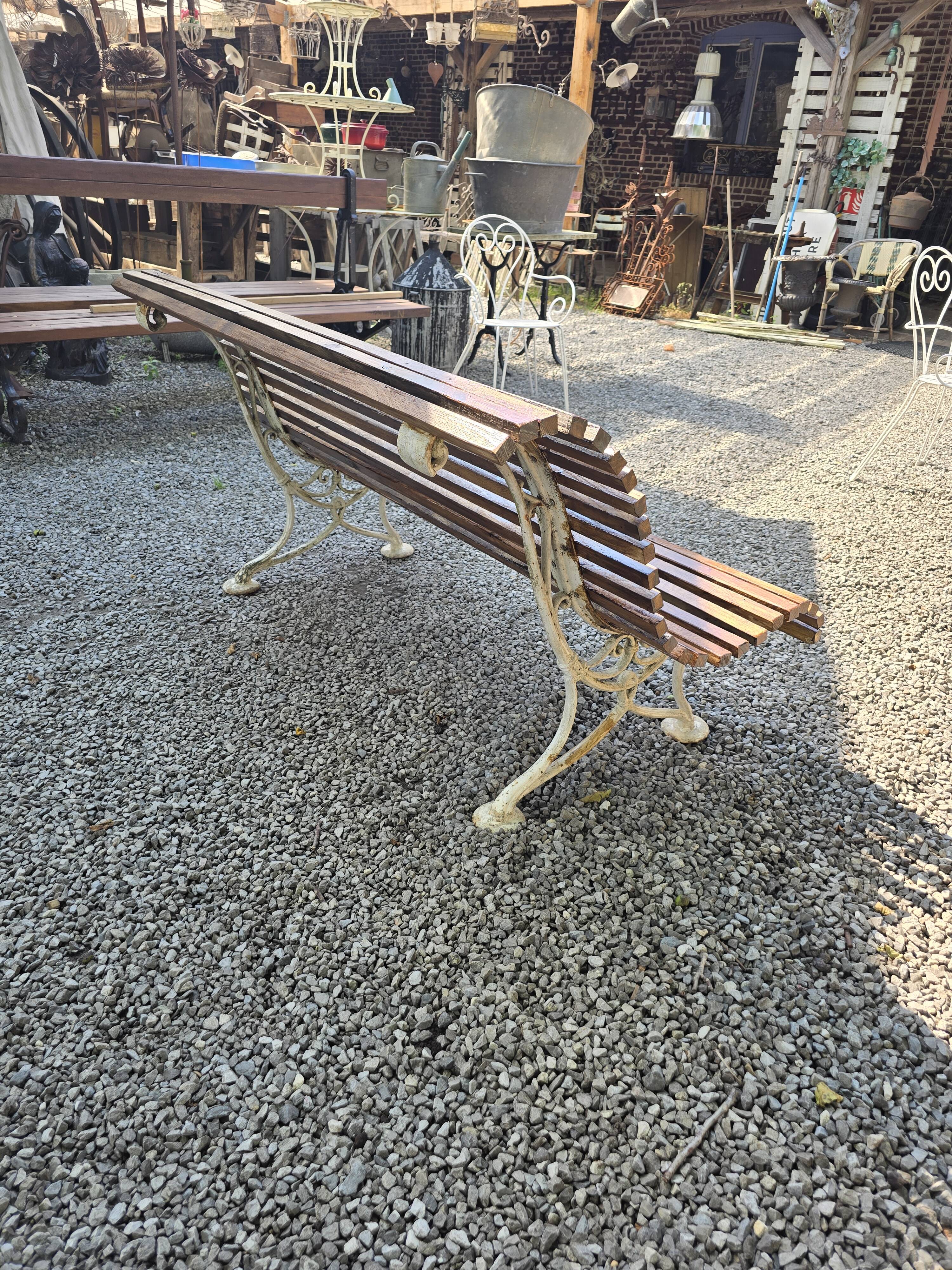 Garden bench with cast iron legs and oak slats